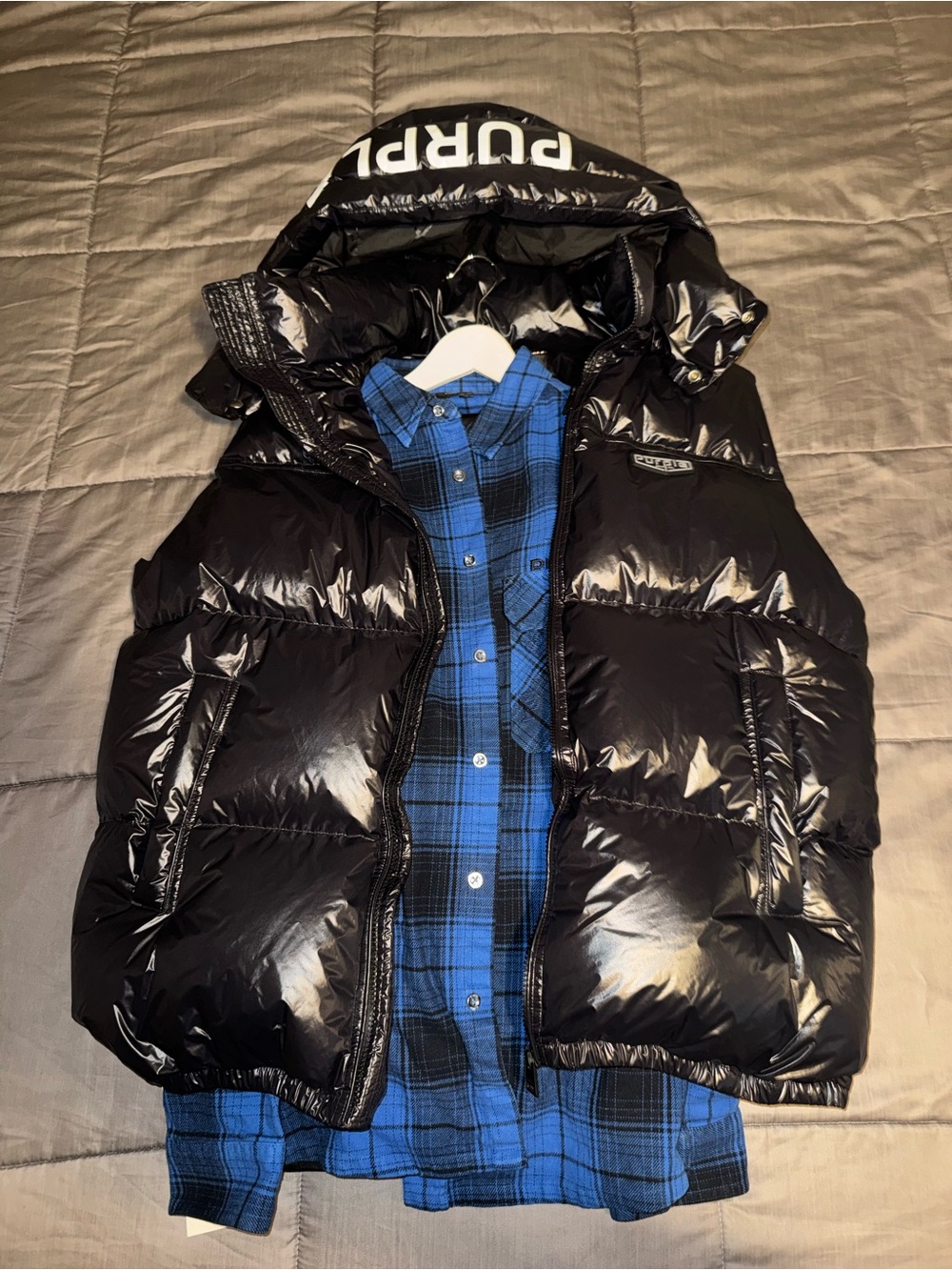 Men’s Black Glossy Puffer Vest with Hood - Logo Accent. Black Jeans, Blue Shirt